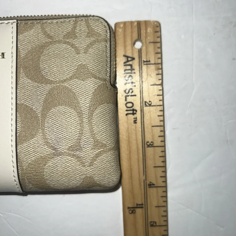 COACH Corner Zip Wristlet in Signature Canvas Stripe Gold Tone Logo Cream/Sand
